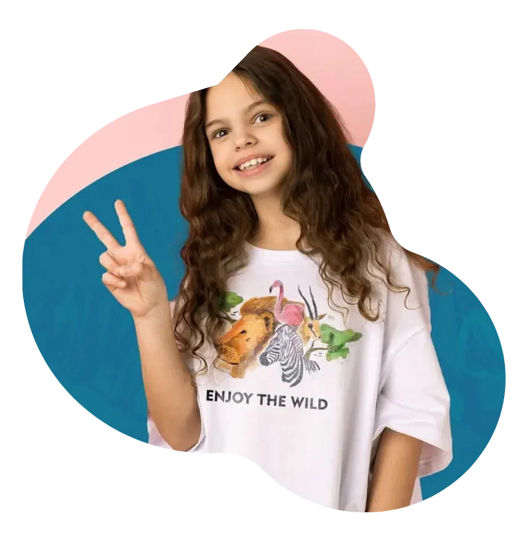 Happy kid in a playful custom T-shirt with animal prints – representing freedom, creativity, and why our prints speak louder than trends